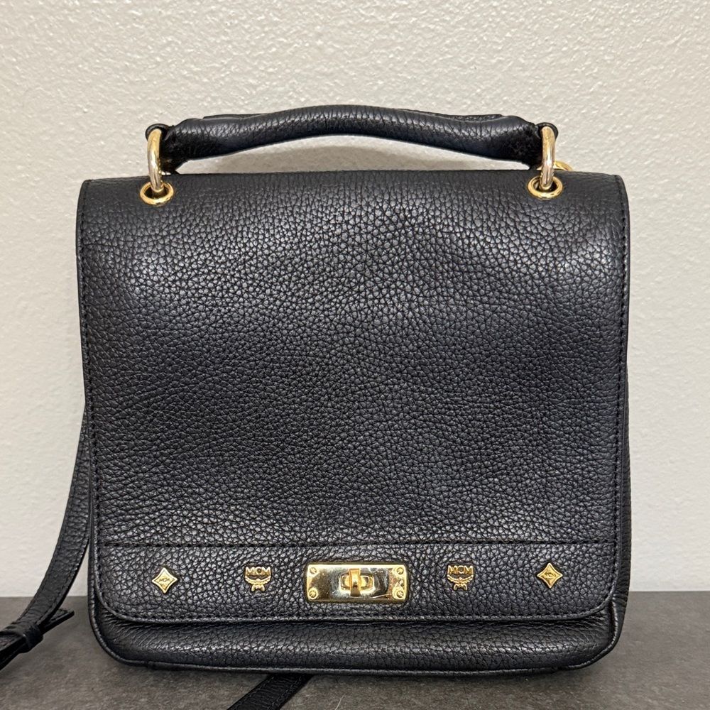 Preloved black MCM crossbody with gold tone hardware